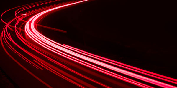 Lights Of Cars Driving At Night. Long Exposure